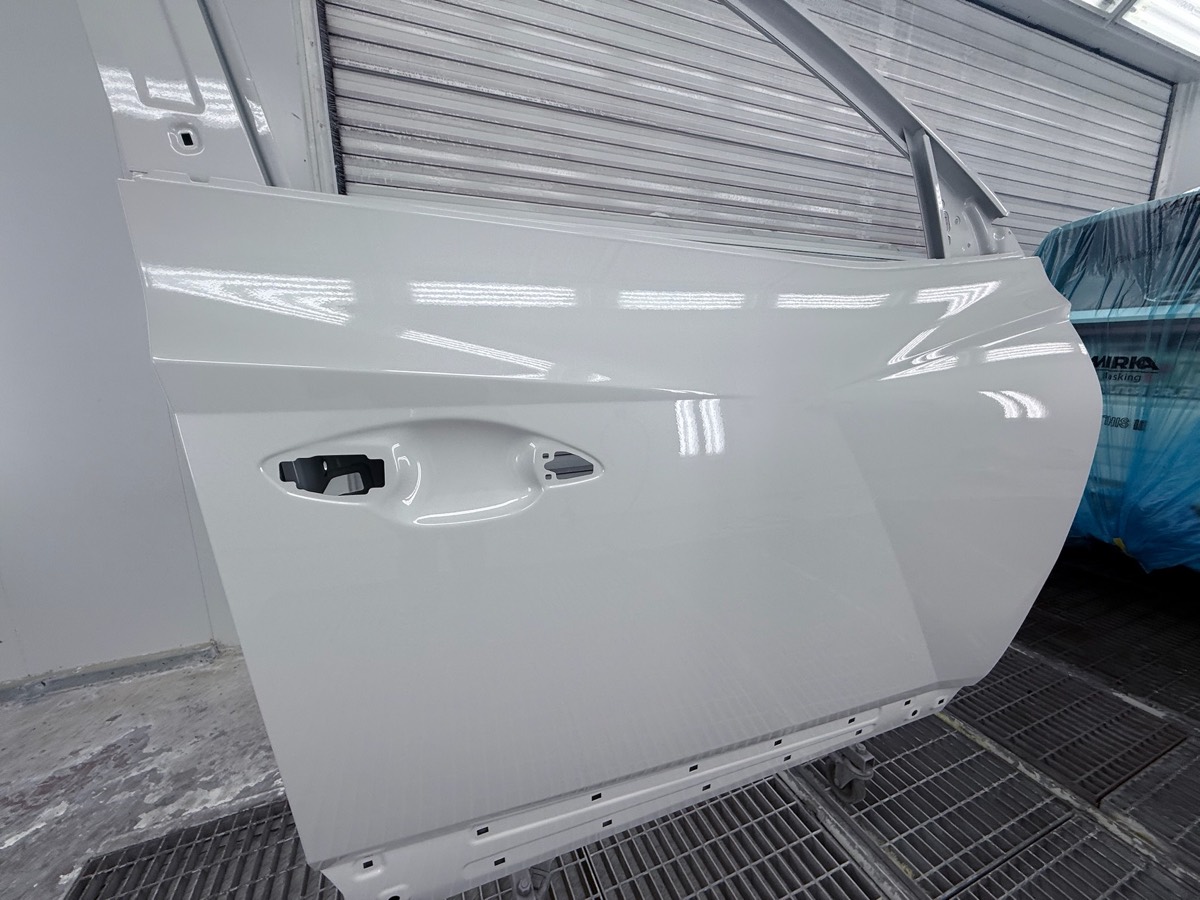 A freshly refinished panel color-matched to factory paint at Collision Center Orlando