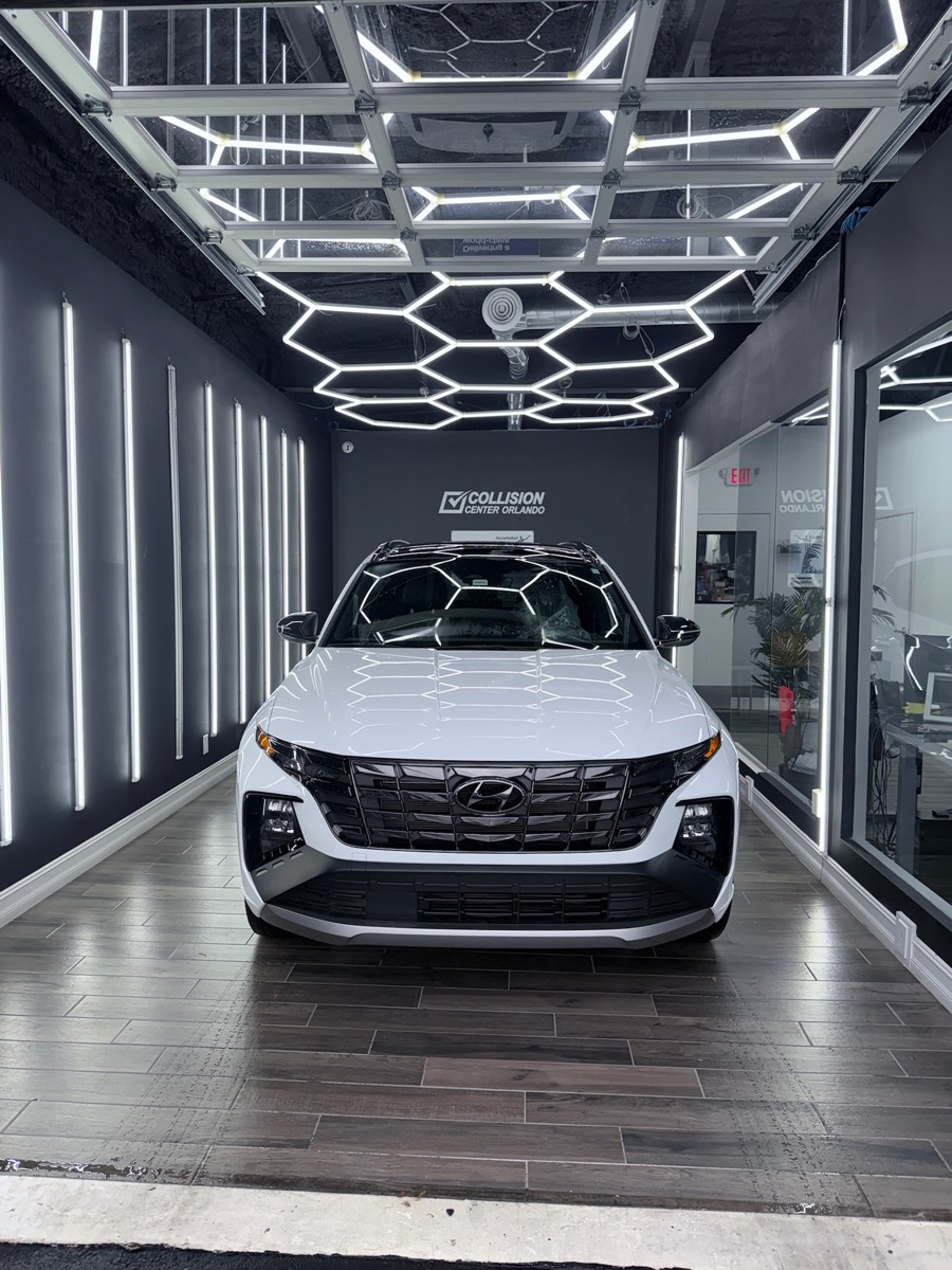 White Hyundai SUV restored and ready for delivery after auto body repair in Orlando