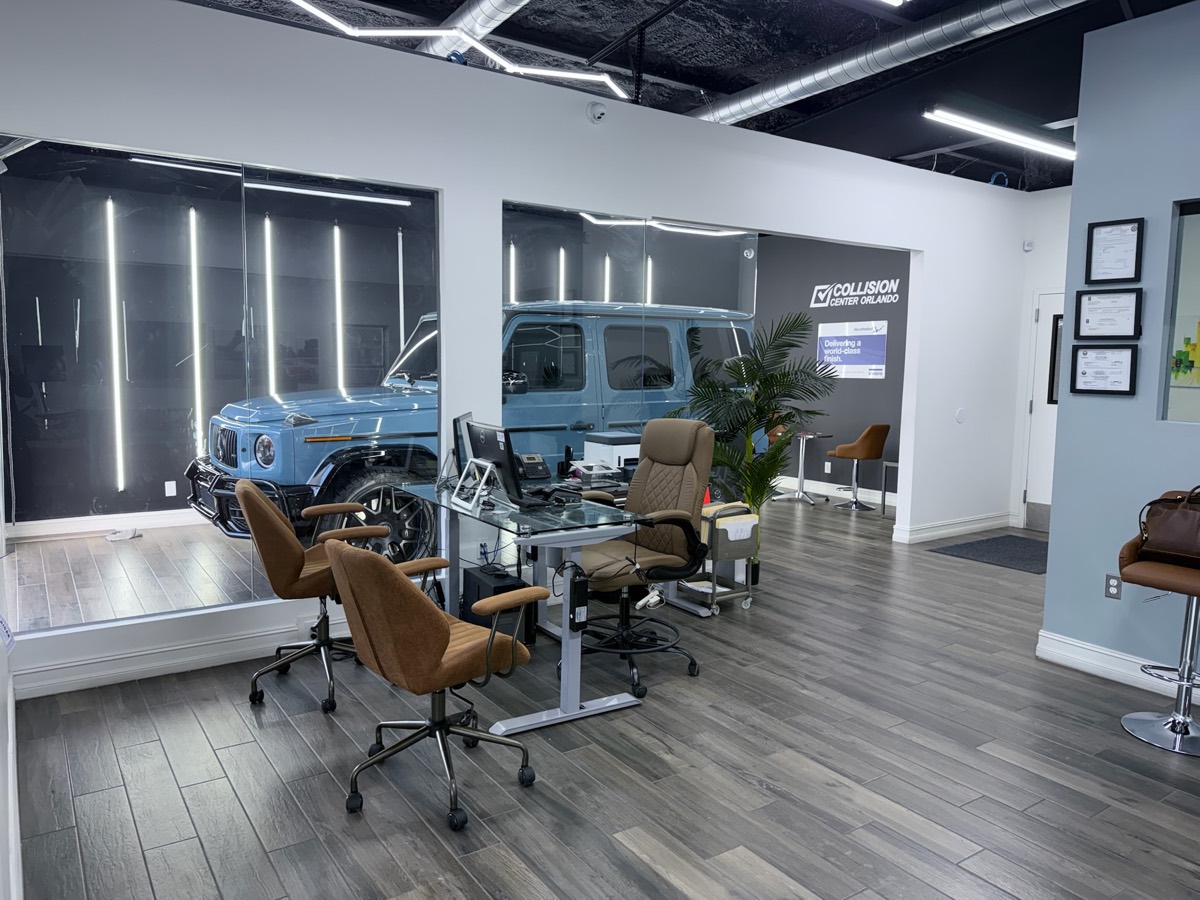 Clean, modern customer lounge at the Collision Center Orlando auto body shop