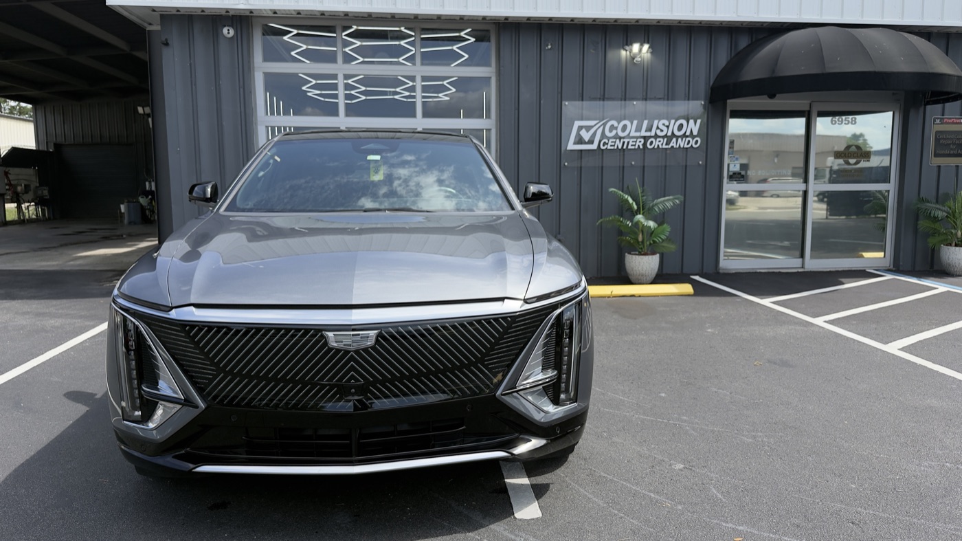 Silver Cadillac Lyriq completed and detailed outside the Collision Center Orlando shop in Orlando